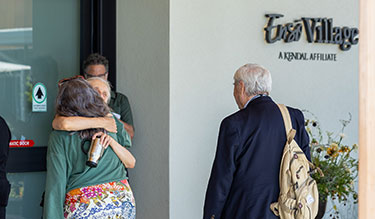 2 people hugging at Enso Village