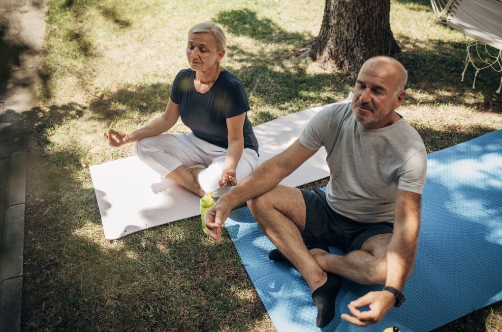 Senior couple doing daily meditation